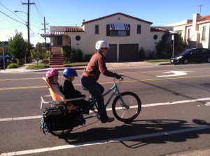 Riding off with my son's feet off the ground, for once.