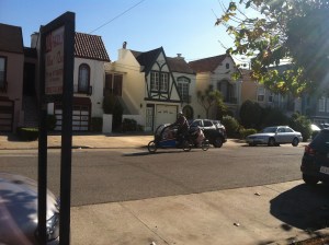 It's hard to see, but Matt has a 4 year old and 2 year old in the front box as well as our daughter on the trailer-bike.