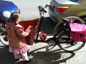 Bakfiets short from My Dutch Bike, which I am discouraging my daughter from climbing into when this photo was taken