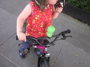 Check out those handlebars: front and rear brake! She can stop while eating a cupcake. 